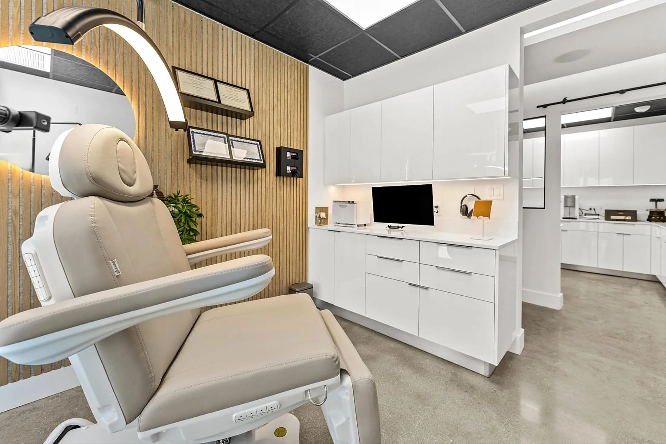 Treatment room with built-in cabinetry and finished drywall