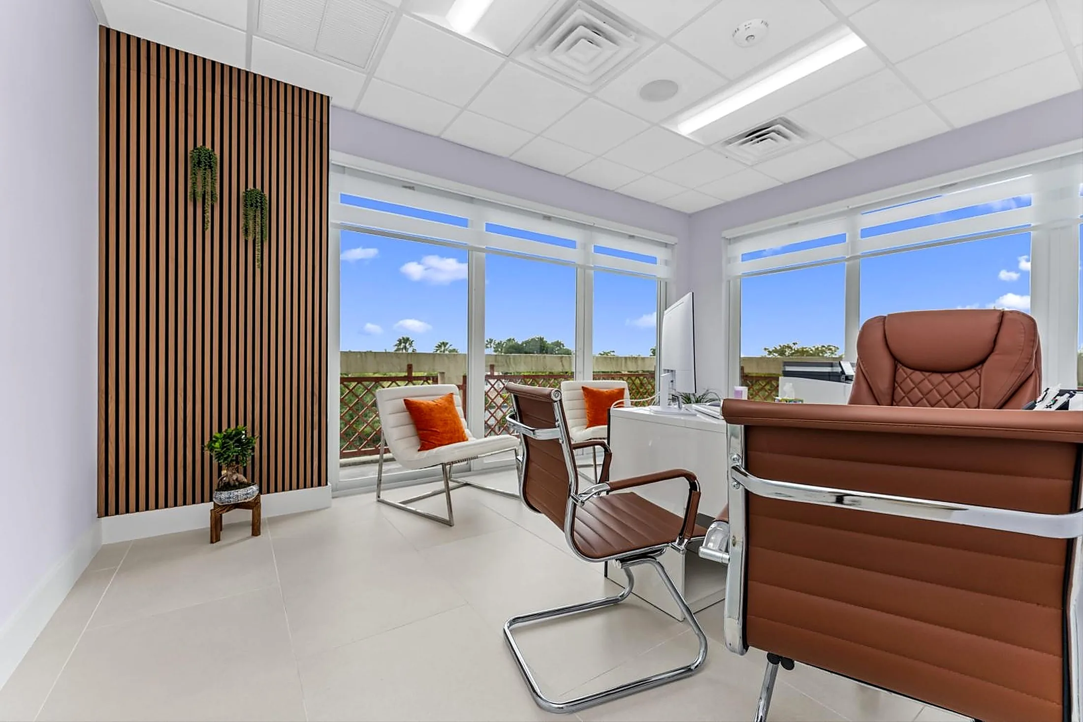 Private office with smooth drywall walls and acoustical ceiling